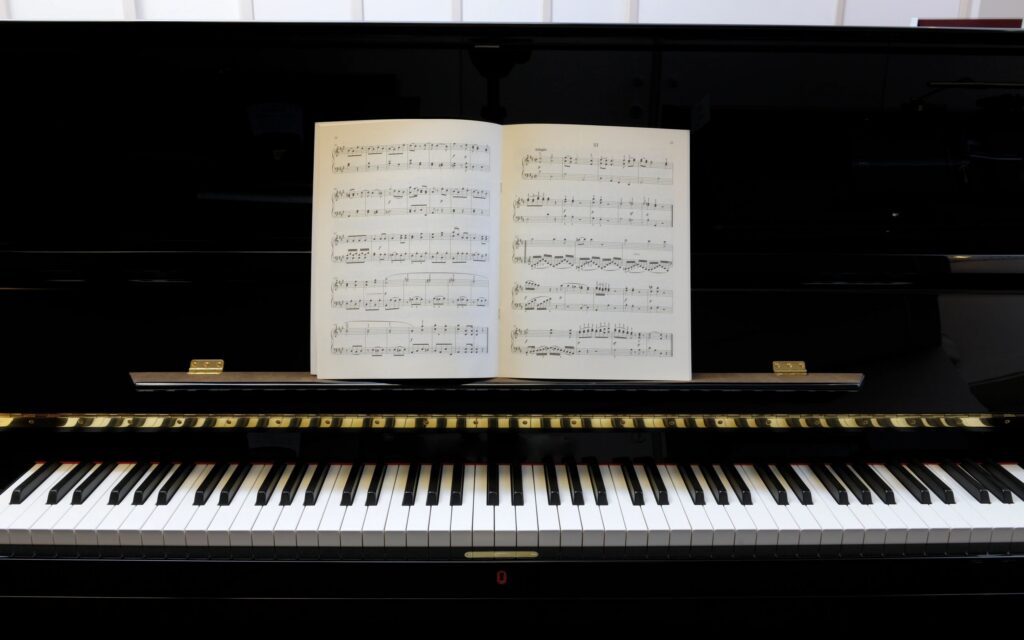 sheet music on black lacquered piano XXXL image